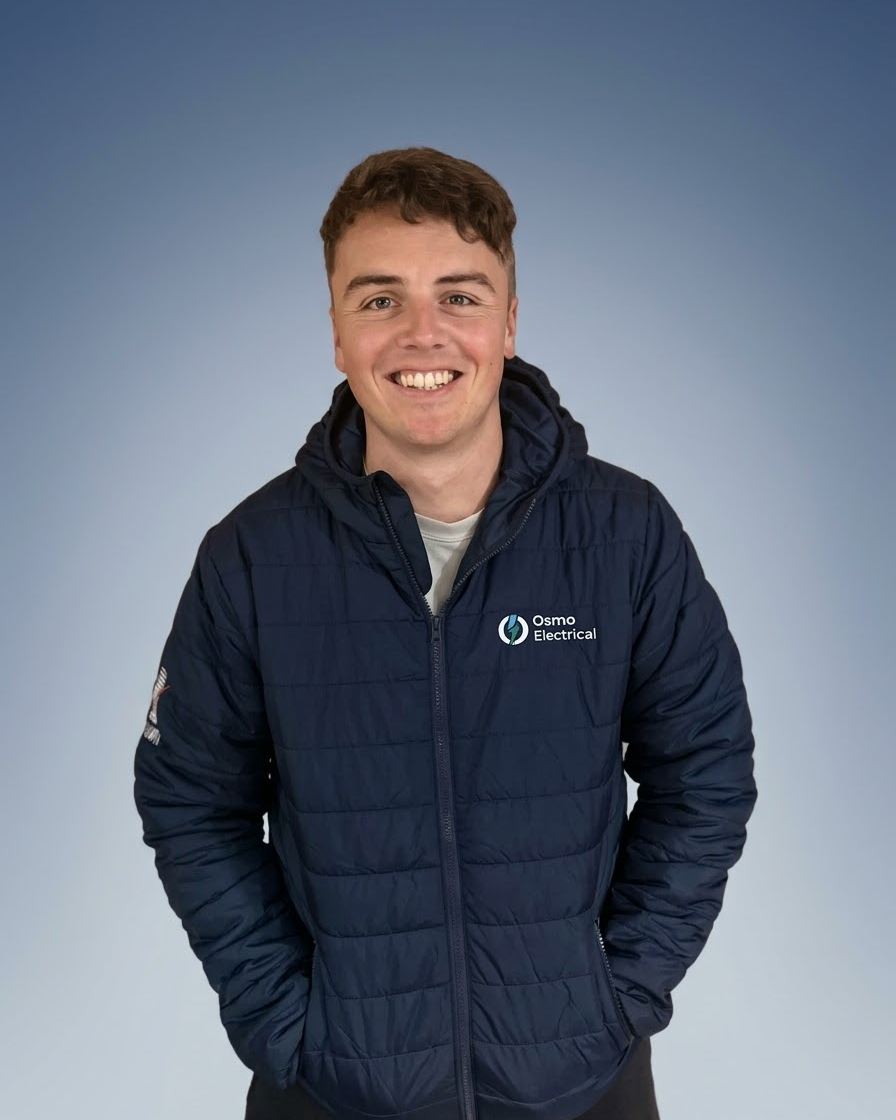 Liam, owner and electrician at Osmo Electrical, in his Osmo Electrical jacket